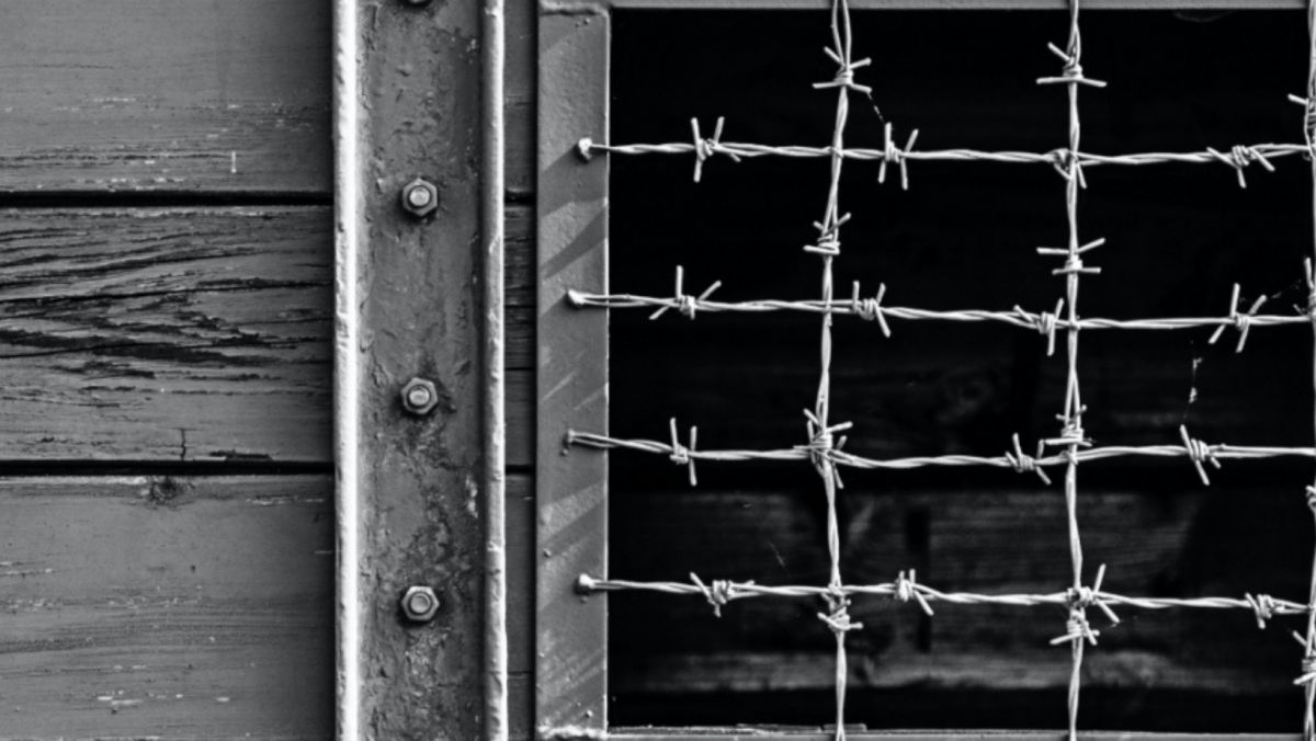 Close up of a barbed wire gate
