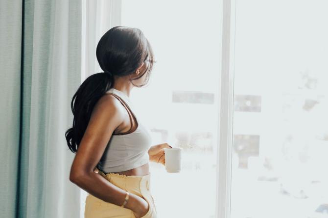 woman turning to look out window