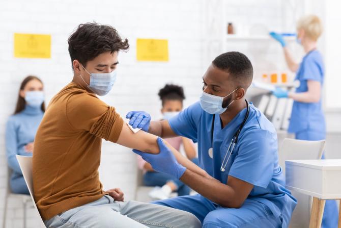 person being injected with vaccine