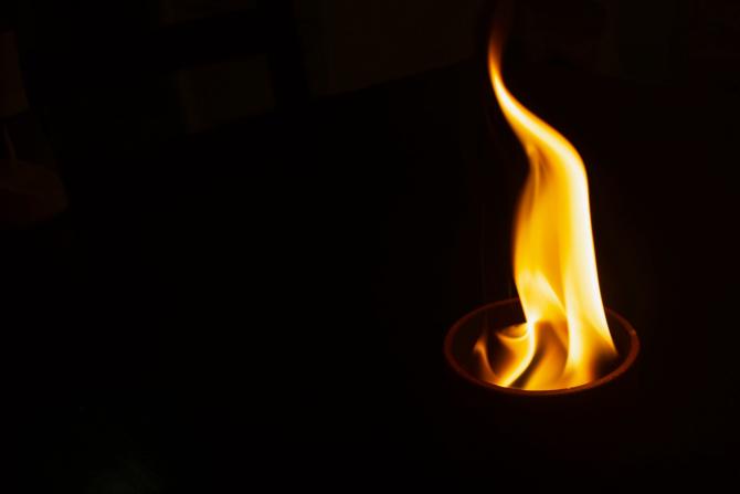 flame against dark background