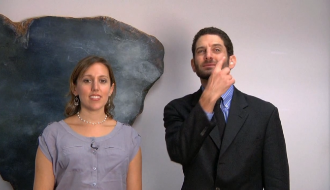 Rabbi Roni Handler and Rabbi Darby Leigh singing and signing in ASL