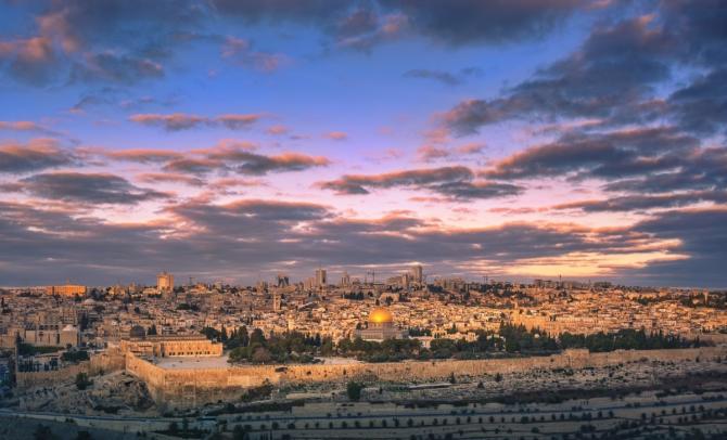 Old city of Jerusalem with violet cloudy sky overhead