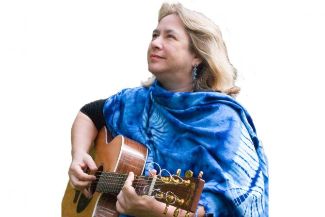 woman in blue tallit with guitar