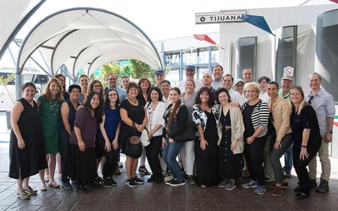 Participants on the HIAS-ADL Border Mission pose for a group photo on the Mexican side of the border before visiting migrant shelters in Tijuana