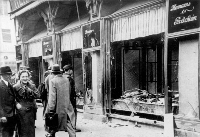historical image of broken shop windows after Kristallnacht in Nazi Germany