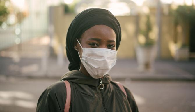 woman wearing mask and head covering