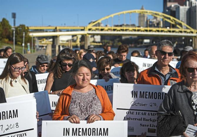 Photo via Alexandra Wimsey / Post-Gazette marchers at gun violence protest holding