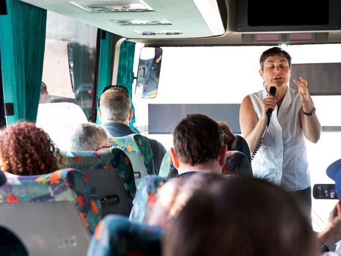 Rabbi Deborah Waxman, President of Reconstructing Judaism, sets the Jewish spiritual context for the HIAS-ADL delegation's visit to Tijuana during the bus ride from San Diego.
