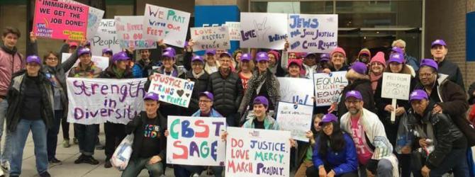 Members of Congregation CBST holding signs at protest march