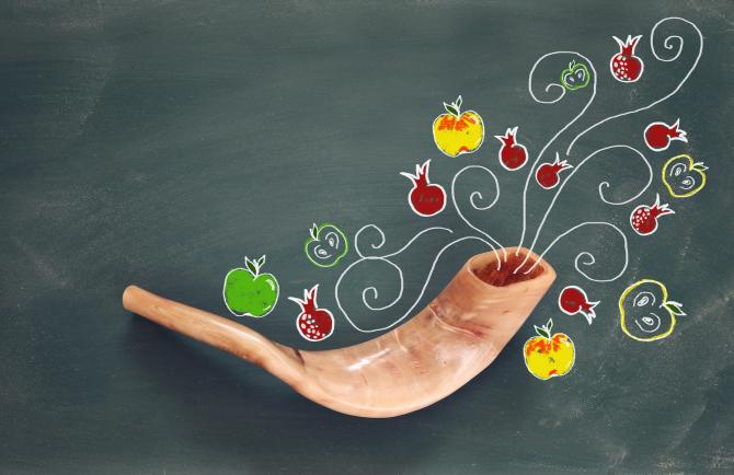 Shofar surrounded by hand-drawn pomegranates and apples