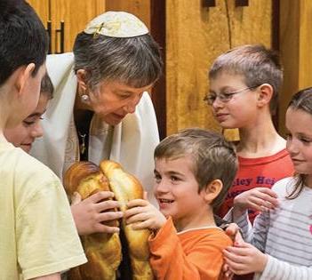 Rabbi Hannah Orden and children at Congregation Beth Hatikvah