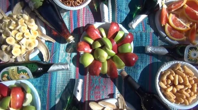 plates of fruit and nuts on a table