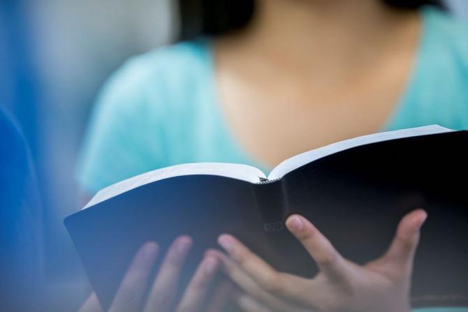 woman holding book