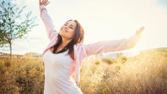 Women smiling with arms outstretched