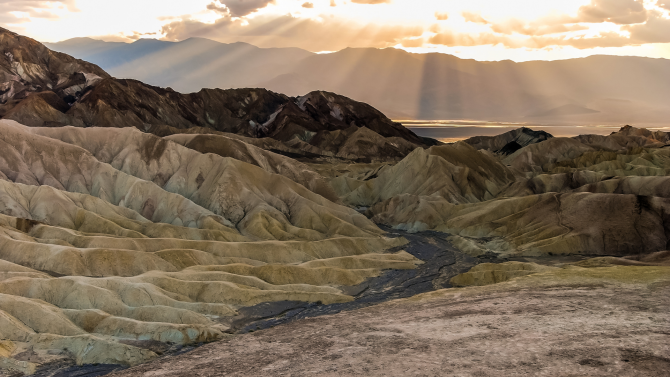 Sun shining over a desert landscape