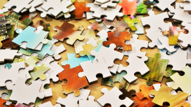 A pile of jigsaw puzzle pieces