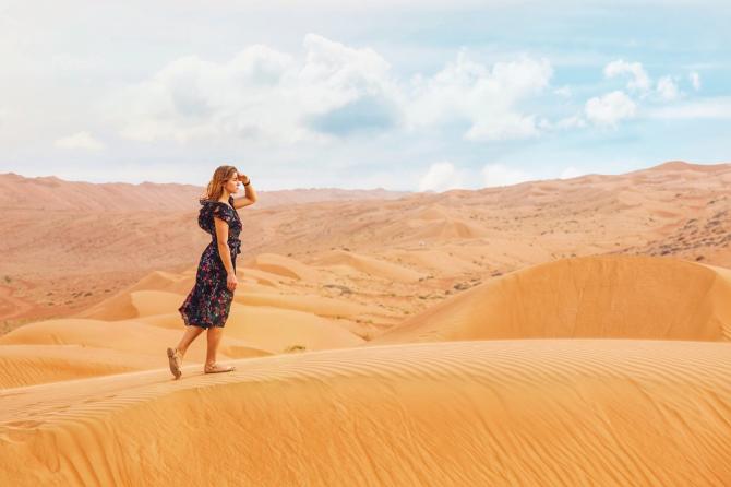 Woman searching in desert