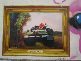 Graffiti art in Tel Aviv - Animal character from Muppets riding in a tank
