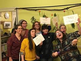 Group holding up signs with word 