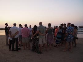 Avi Rubel with Honeymoon Israel couples celebrating Shabbat on the beach in Tel aviv