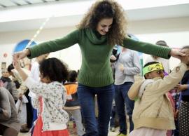 Woman dancing with small children