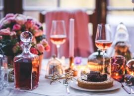 Elegantly set dinner table with wineglasses