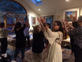 Or Zarua participants raise their hands in a gratitude ritual.