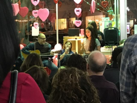 Rabbi Elliott Tepperman playing guitar while co-leading religious services