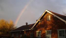 Ner Shalom's building with rainbow in the background