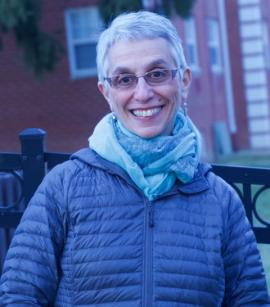 Rabbi Sheila Peltz Weinberg dressed in a winter coat and scarf