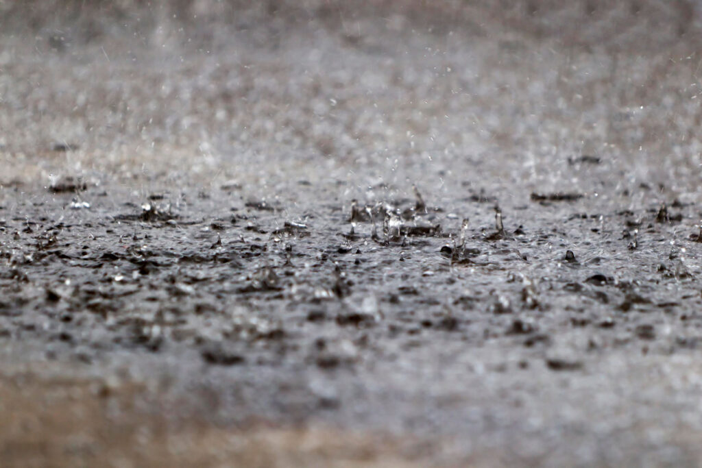 rain drops hitting a puddle