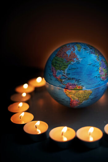 Globe surrounded by tea lights