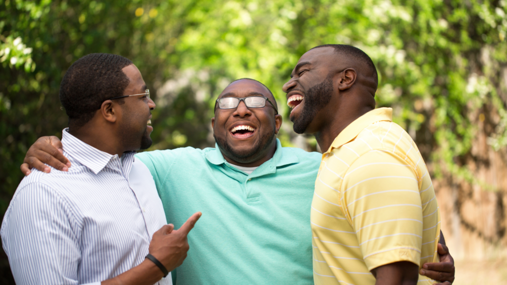 three men embracing