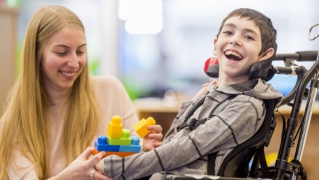 teacher with student in wheelchair