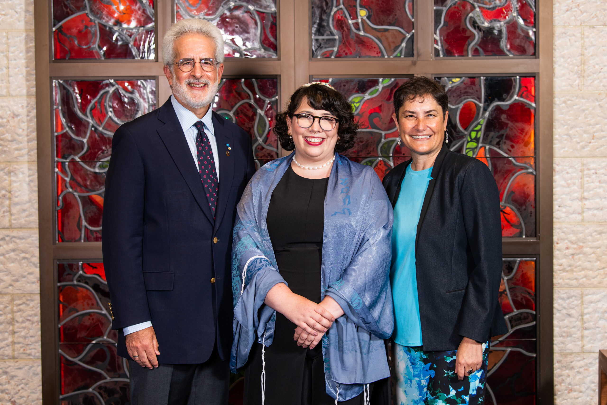 Seth Rosen, chair of Reconstructing Judaism's Board of Governors, stands next to Rabbi Alanna "Lonnie" Kleinman and Rabbi Deborah Waxman, Ph.D. president and CEO of Reconstructing Judaism. 