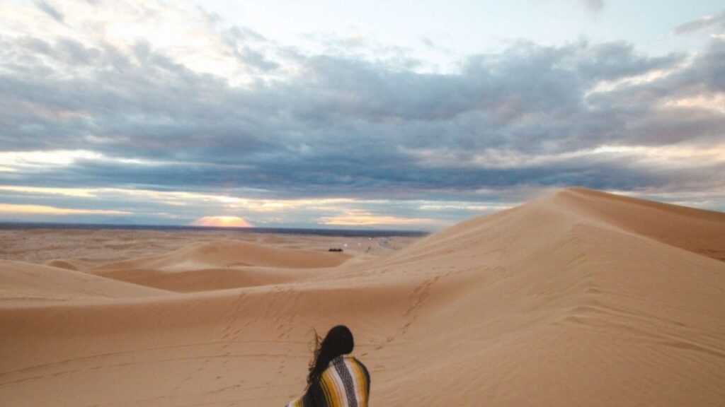 Woman sitting in the desert