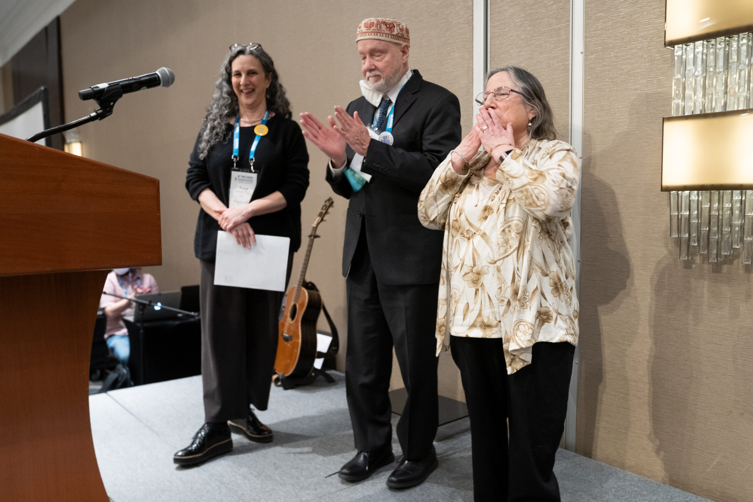 Tresa Grauer, John Riehl and Jackie Land share the stage at Reconstructing Judaism's 2022 convention.
