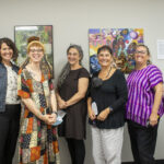 RRC leaders and students stand in front of the newly installed artwork.