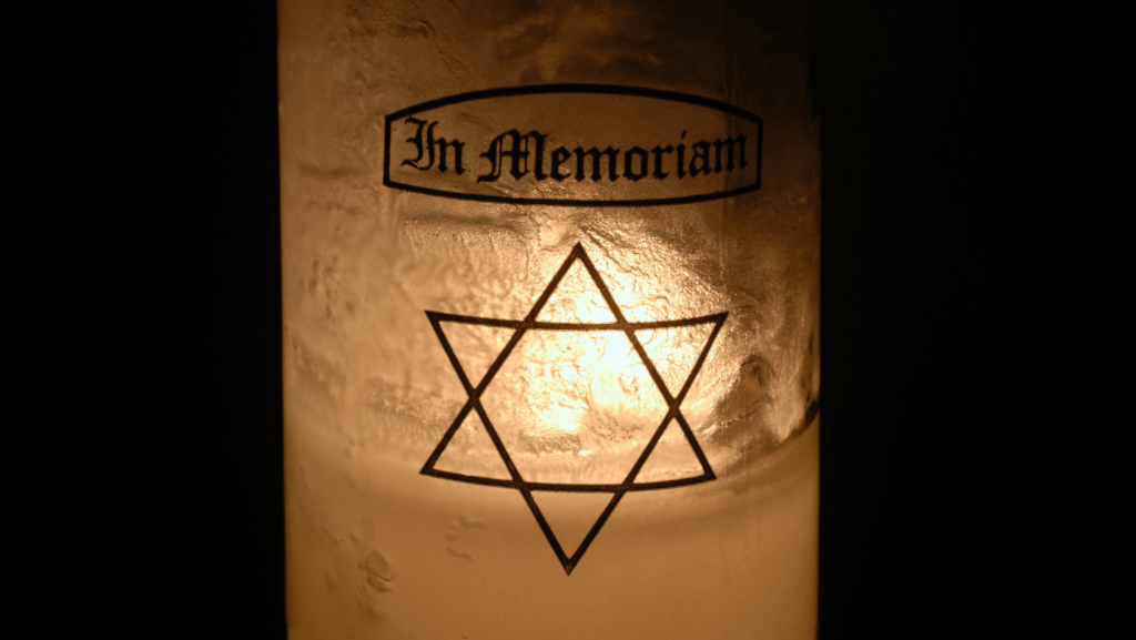 A lit memorial candle