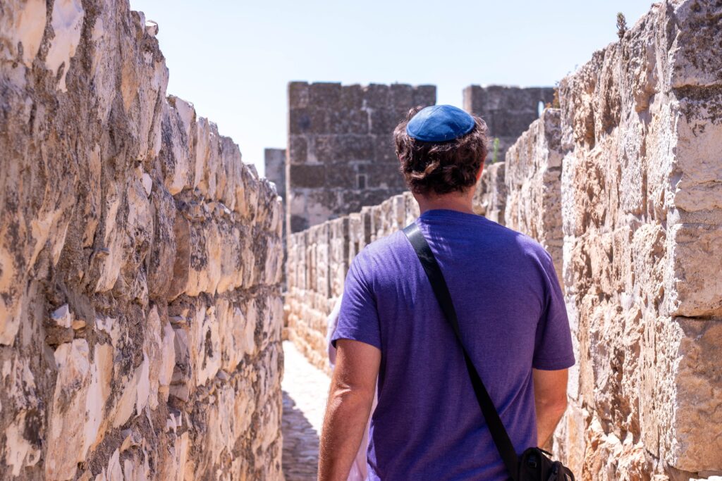 A man walking through a historical site in Israel