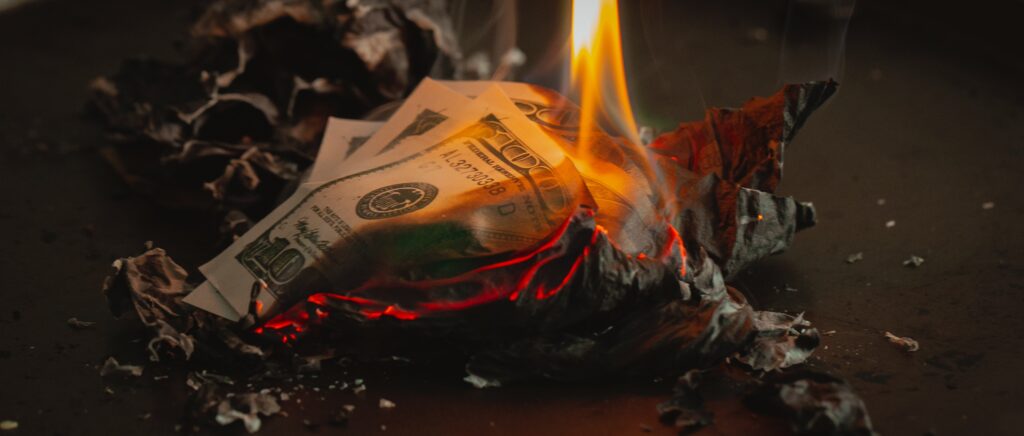 A $100 bill on fire