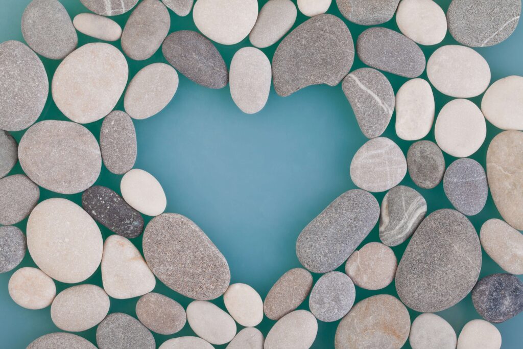 A group of rocks positioned so the negative space creates a heart shape