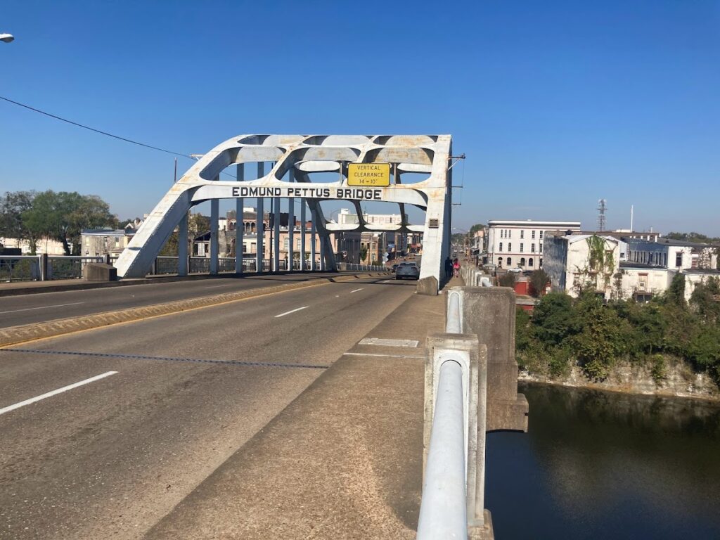 Clear blue sky and a view of the Edmund Pettus Bridge.