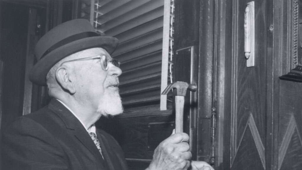 Black and white historical photo of an elderly Jewish man doing a construction project