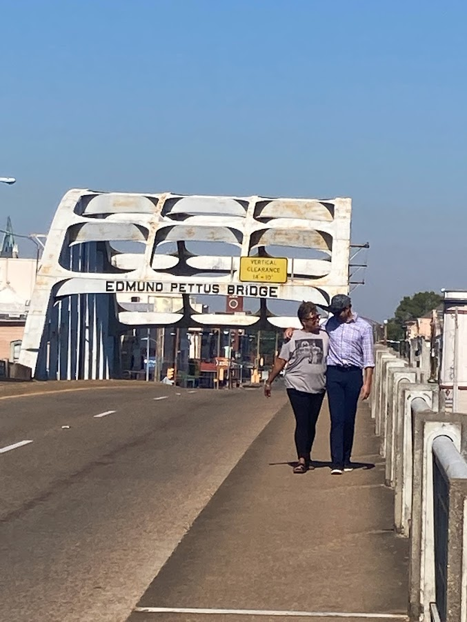 Two paricipants cross the Edmund Pettis Bridge.