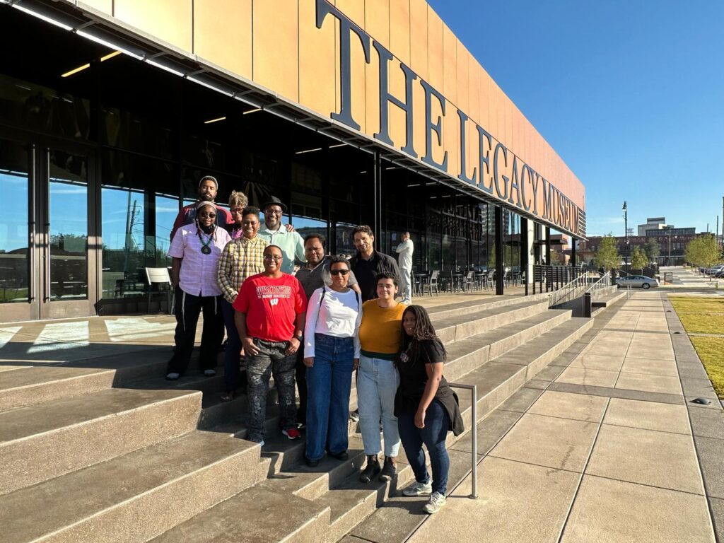 Participants stand outside the Legacy Musuem.