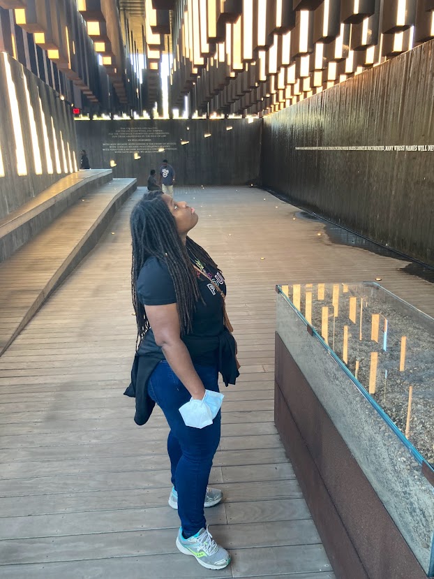 A participant takes in the outdoor memorial.