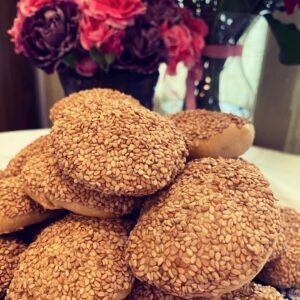 Mizrakhi Cookies on a blue and white plate with flowers behind
