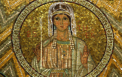 A mosaic depicting a woman with a halo, holding a staff, surrounded by intricate golden and colorful tiles.