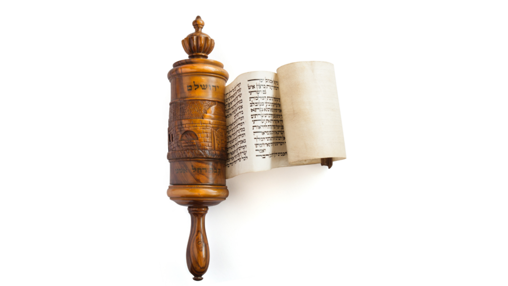 A wooden Torah scroll case with Hebrew text and an open parchment.